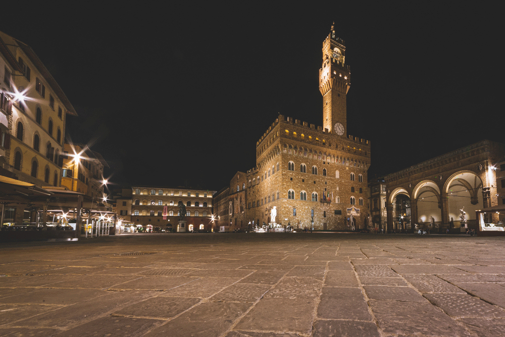 Square in Siena, Italy at night.